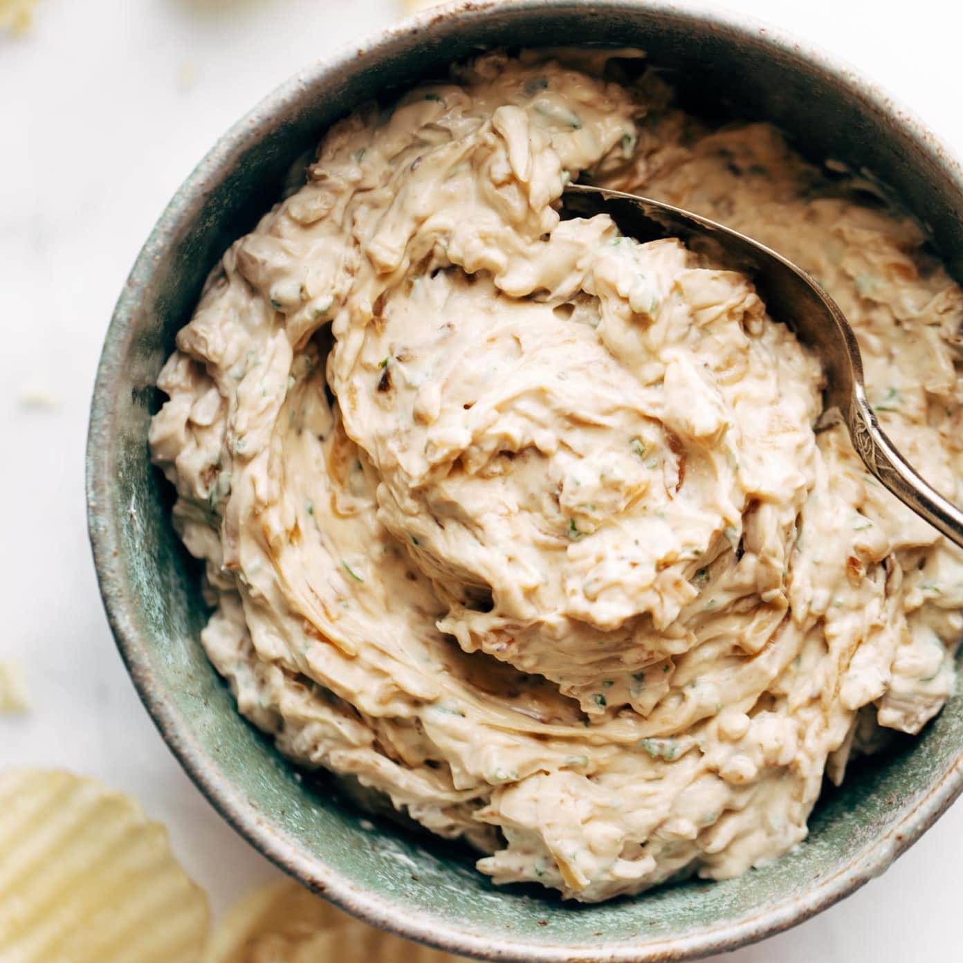 A large rustic bowl of onion dip.